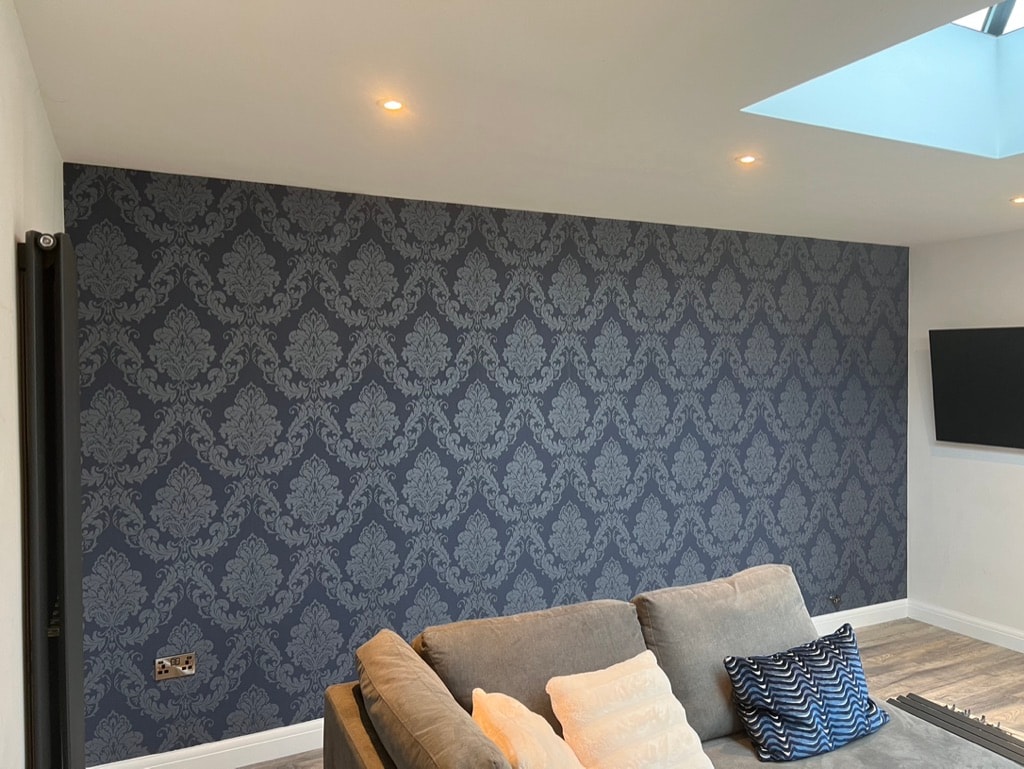 Modern living room with damask wallpaper feature wall