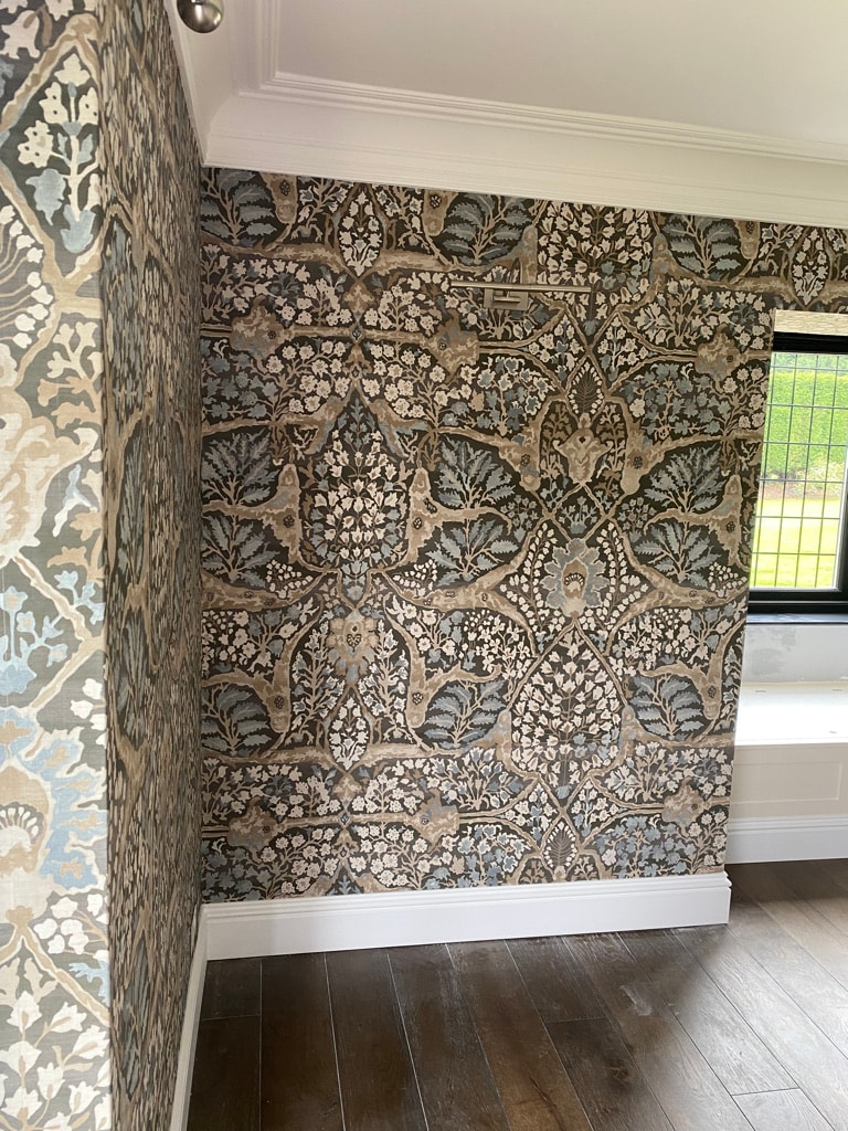 Ornate damask wallpaper in an interior hallway — decorating project