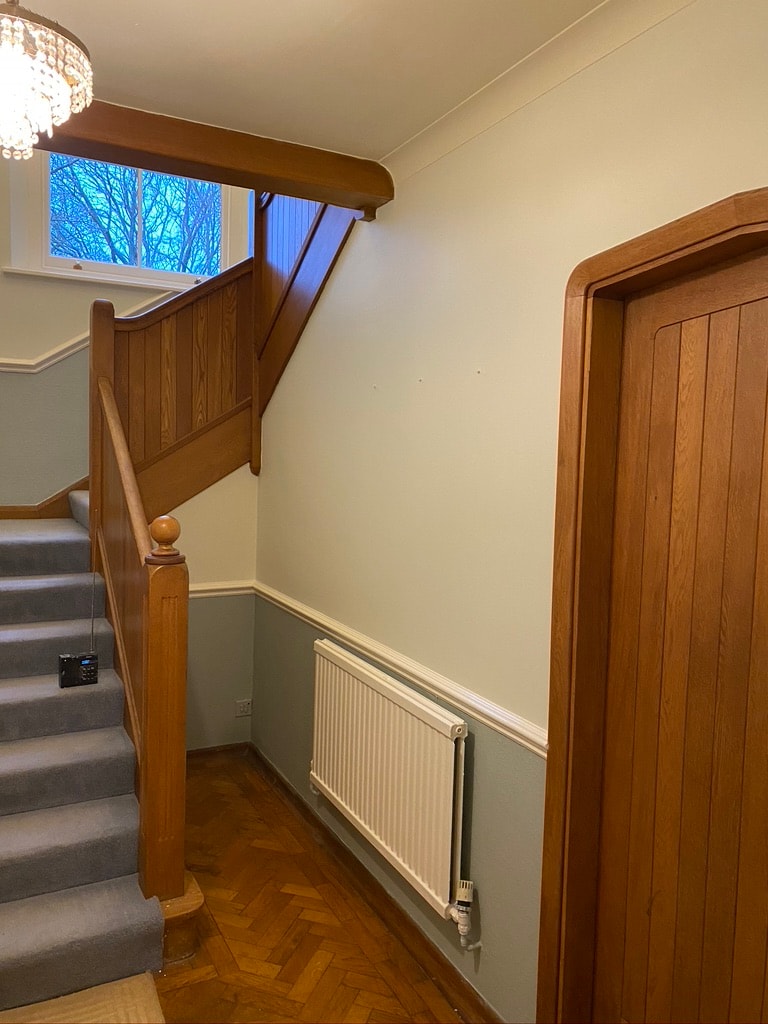 Residential hallway with wooden staircase — decorating project